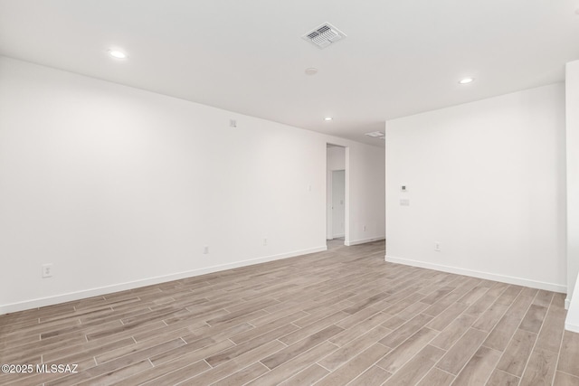 empty room with light hardwood / wood-style floors