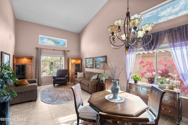 2578 W Mystic Mountain Dr, Tucson, AZ 85742 - dining space with high vaulted ceiling, a chandelier, light tile patterned floors, and baseboards