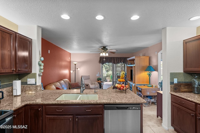 2578 W Mystic Mountain Dr, Tucson, AZ 85742 - kitchen featuring dishwasher, a sink, decorative backsplash, a textured ceiling, and a peninsula