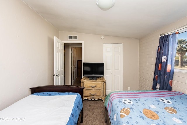 carpeted bedroom featuring a closet and vaulted ceiling