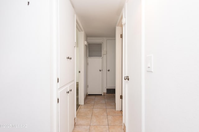 hallway with light tile patterned floors