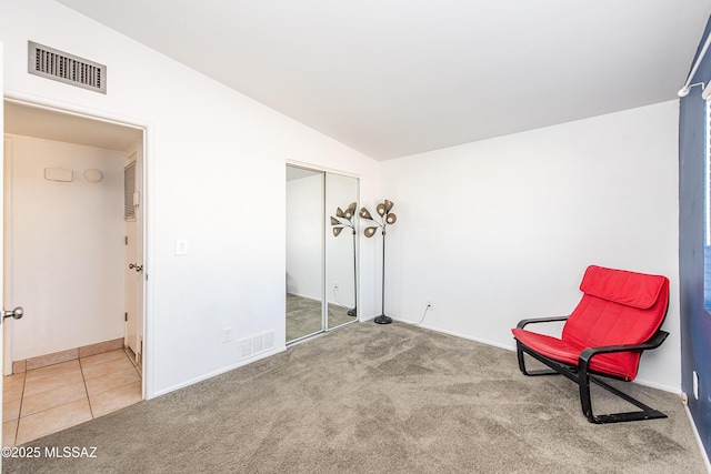 unfurnished room with vaulted ceiling and carpet floors