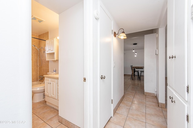 hall with light tile patterned flooring