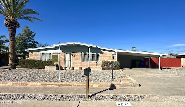 single story home with a carport