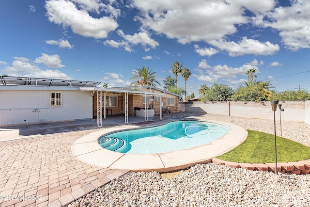 view of swimming pool with a patio