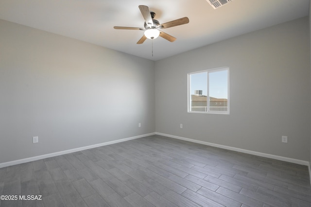 empty room with ceiling fan and hardwood / wood-style floors