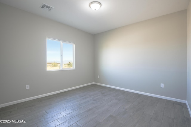 empty room featuring dark hardwood / wood-style floors