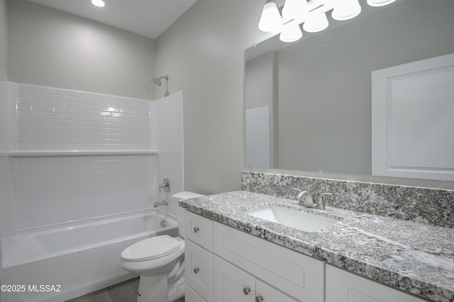 full bathroom with toilet, washtub / shower combination, and vanity