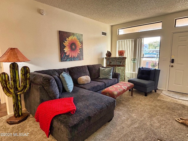 carpeted living room with a textured ceiling