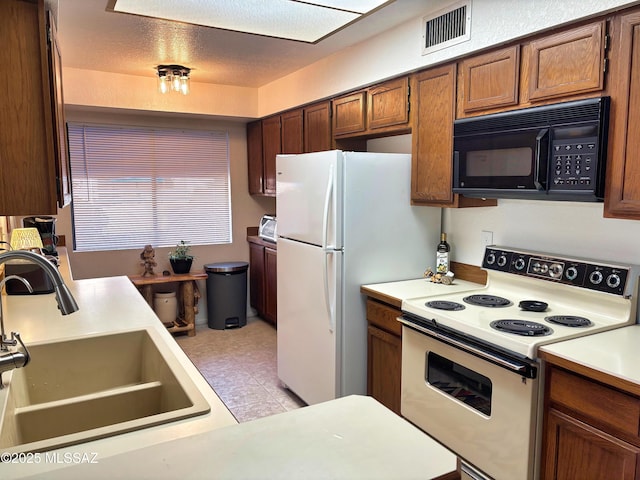 kitchen with sink and white electric stove