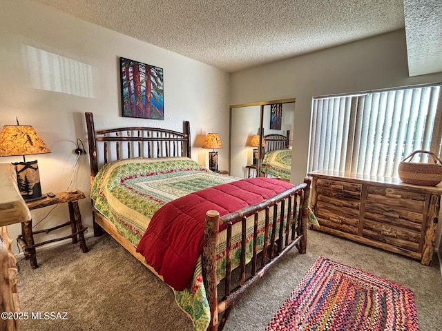 carpeted bedroom featuring a closet and a textured ceiling