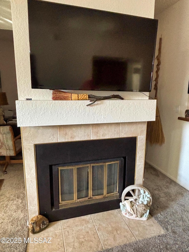 details with a tile fireplace