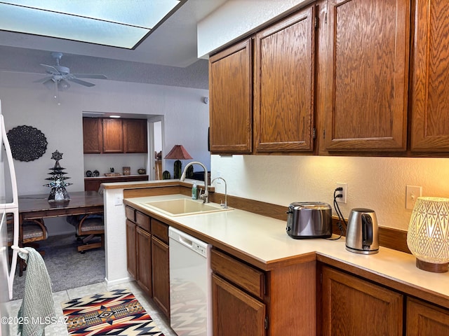 kitchen featuring ceiling fan, sink, light tile patterned floors, and white appliances