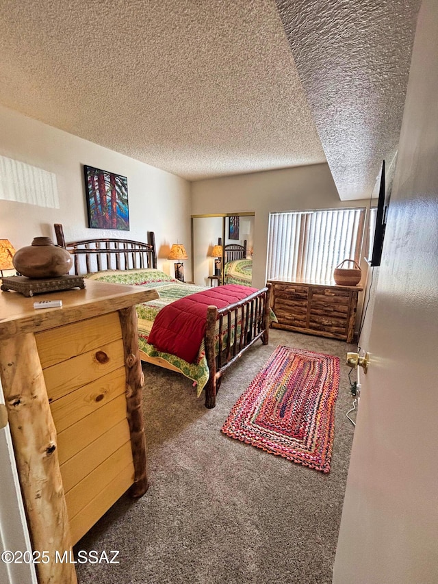 carpeted bedroom with a textured ceiling