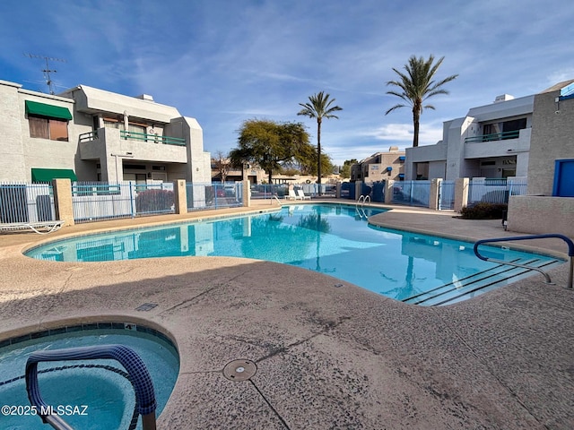 view of pool featuring a hot tub