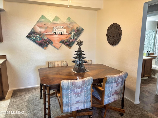 dining space featuring carpet