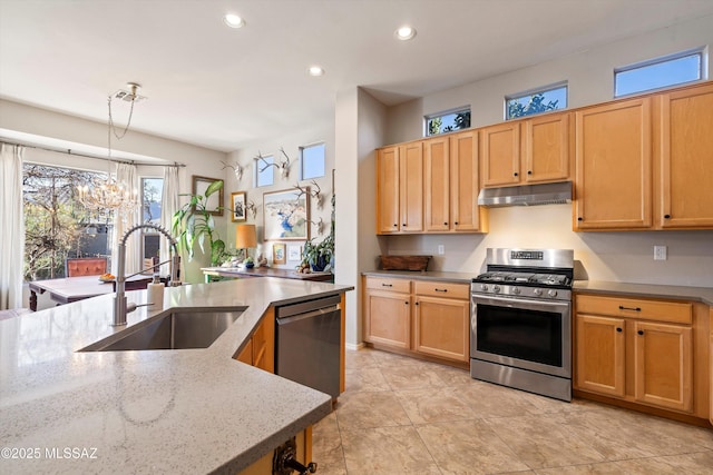 kitchen featuring dishwasher, pendant lighting, sink, light tile patterned floors, and gas range