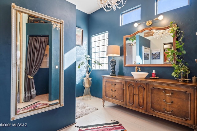 bathroom featuring a chandelier and vanity