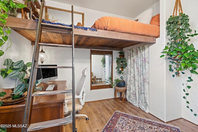 bedroom with light wood-type flooring