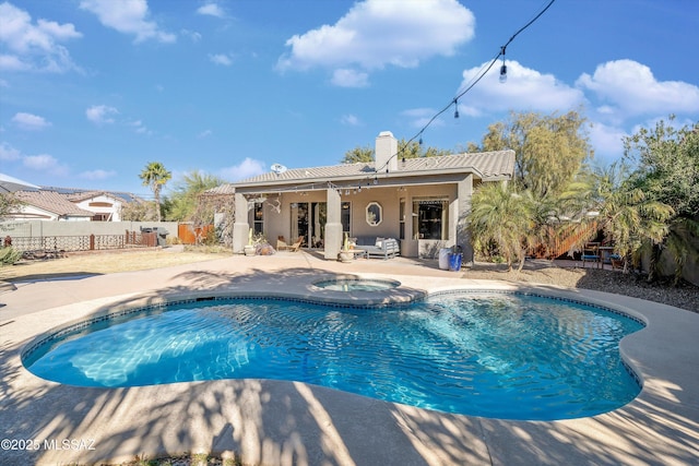 view of pool featuring a patio area and an in ground hot tub