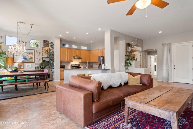 tiled living room with ceiling fan