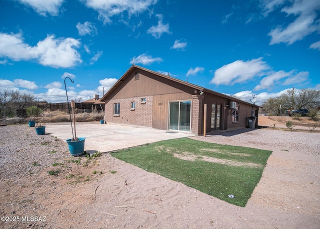 back of property featuring a patio area