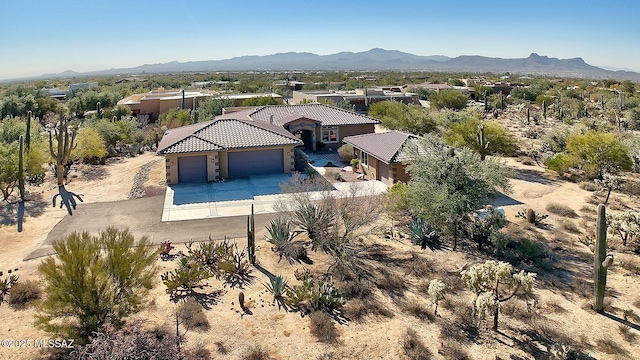 birds eye view of property with a mountain view