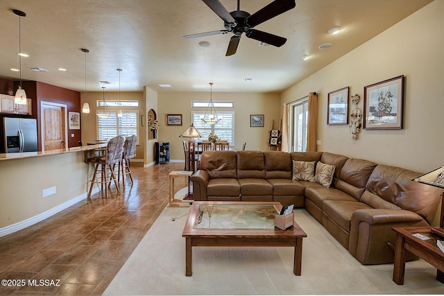 tiled living room with ceiling fan