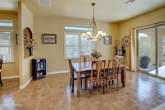 dining area with a notable chandelier