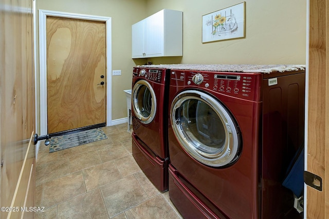 laundry area with cabinets and separate washer and dryer