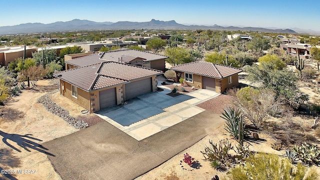 drone / aerial view featuring a mountain view