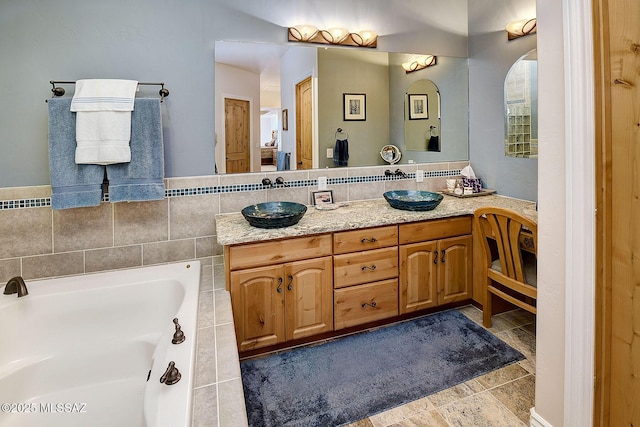 bathroom with vanity and a bathing tub