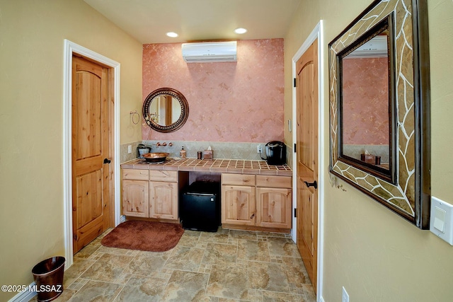 bathroom featuring vanity and a wall mounted air conditioner