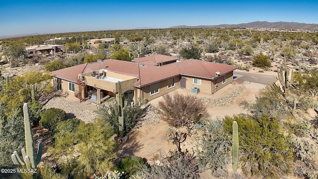 birds eye view of property with a mountain view