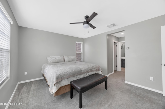 bedroom featuring multiple windows, carpet floors, and ceiling fan