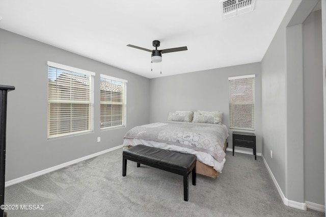 bedroom featuring light colored carpet and ceiling fan