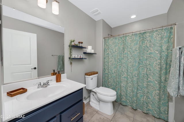 full bathroom with vanity, tile patterned floors, toilet, and shower / bathtub combination with curtain