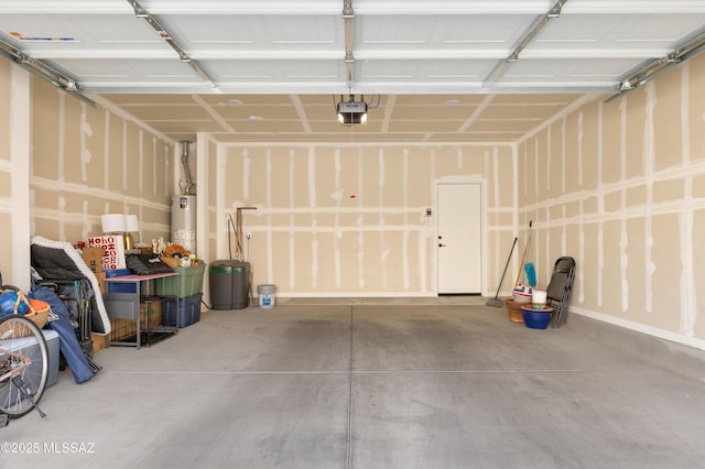 garage with water heater and a garage door opener