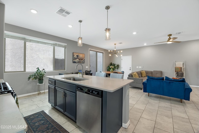 kitchen with sink, light tile patterned floors, dishwasher, an island with sink, and pendant lighting