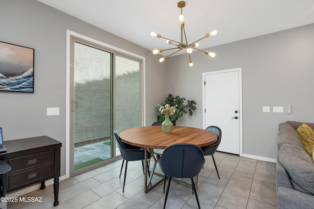 tiled dining space with a chandelier