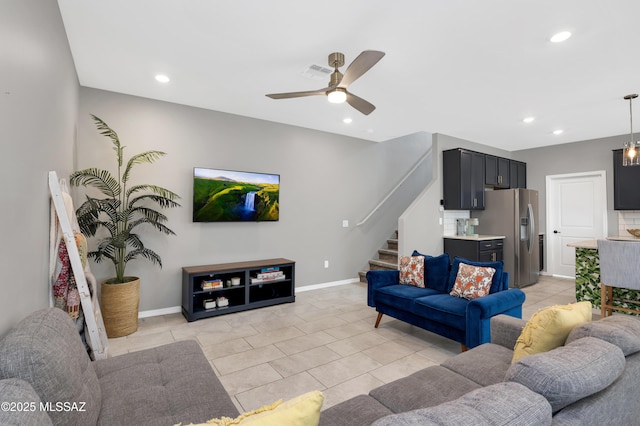 tiled living room with ceiling fan