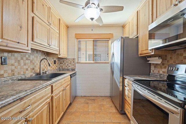 kitchen featuring sink, light tile patterned floors, ceiling fan, appliances with stainless steel finishes, and light brown cabinetry