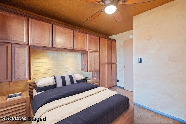 tiled bedroom with ceiling fan