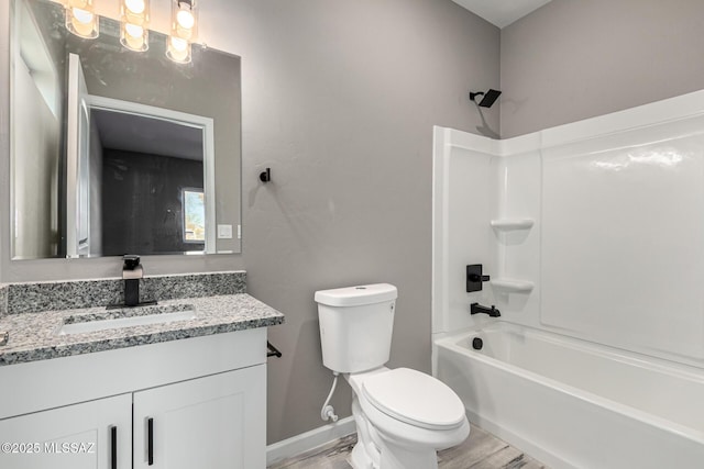 full bathroom featuring toilet, hardwood / wood-style floors, vanity, and shower / bathing tub combination