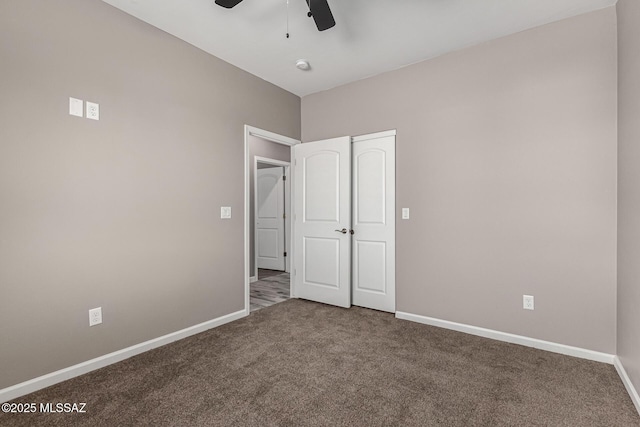 unfurnished bedroom featuring ceiling fan and carpet floors