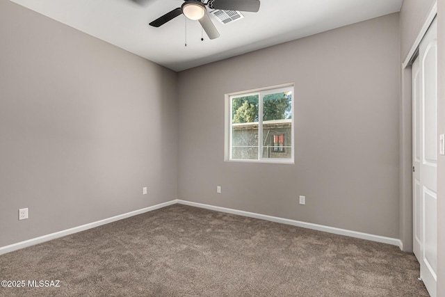 unfurnished bedroom featuring ceiling fan, carpet, and a closet