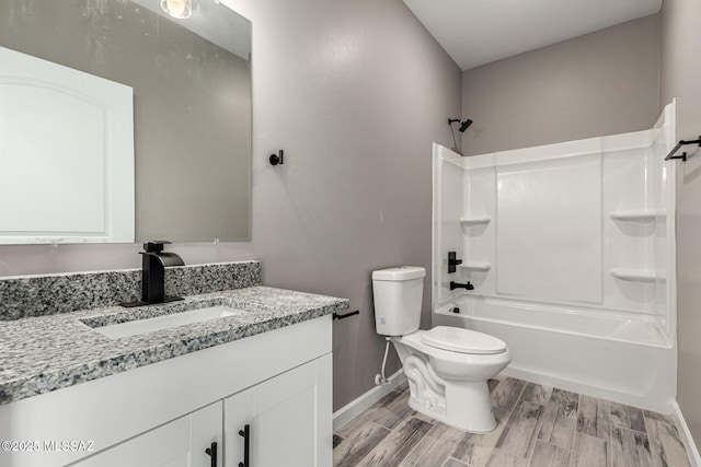 full bathroom with toilet, wood-type flooring, vanity, and bathtub / shower combination