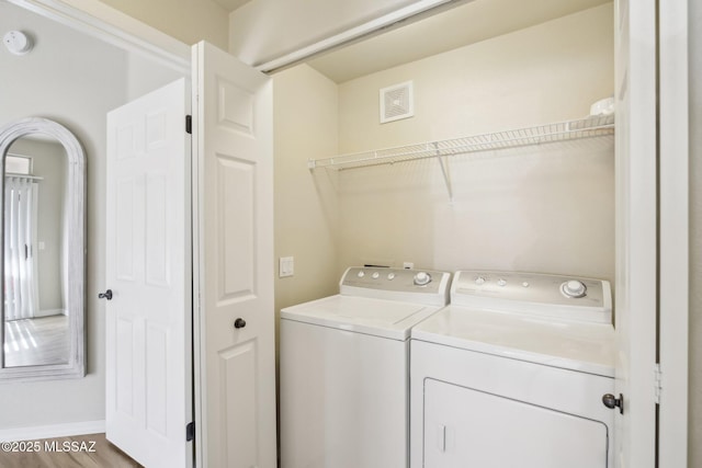 washroom featuring washer and dryer