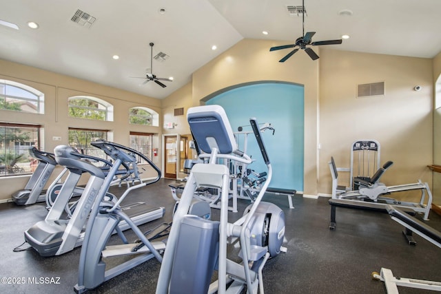 gym with high vaulted ceiling and ceiling fan