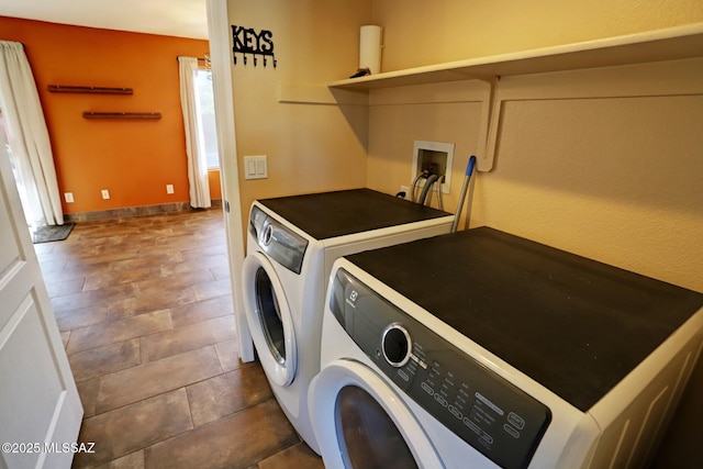 washroom featuring washing machine and dryer